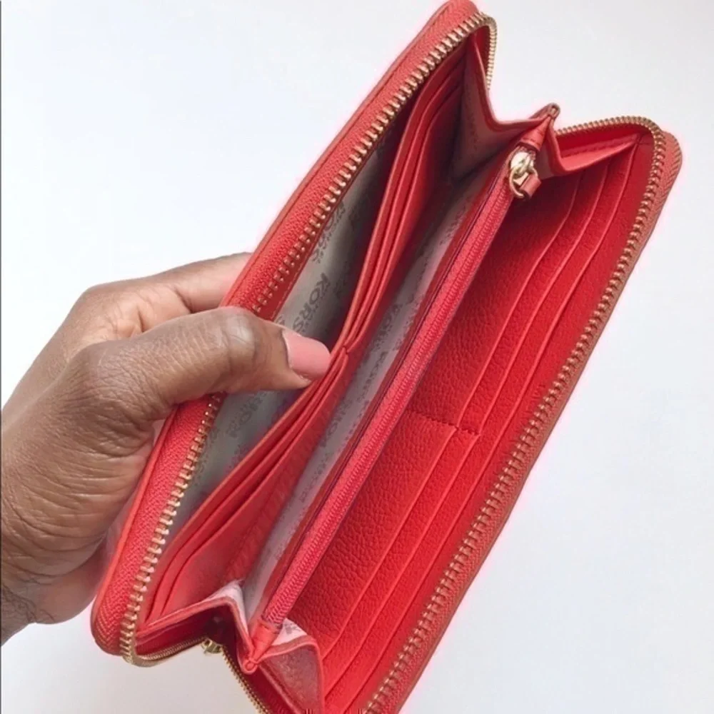 Micheal Kors Orange leather Wallet / clutch